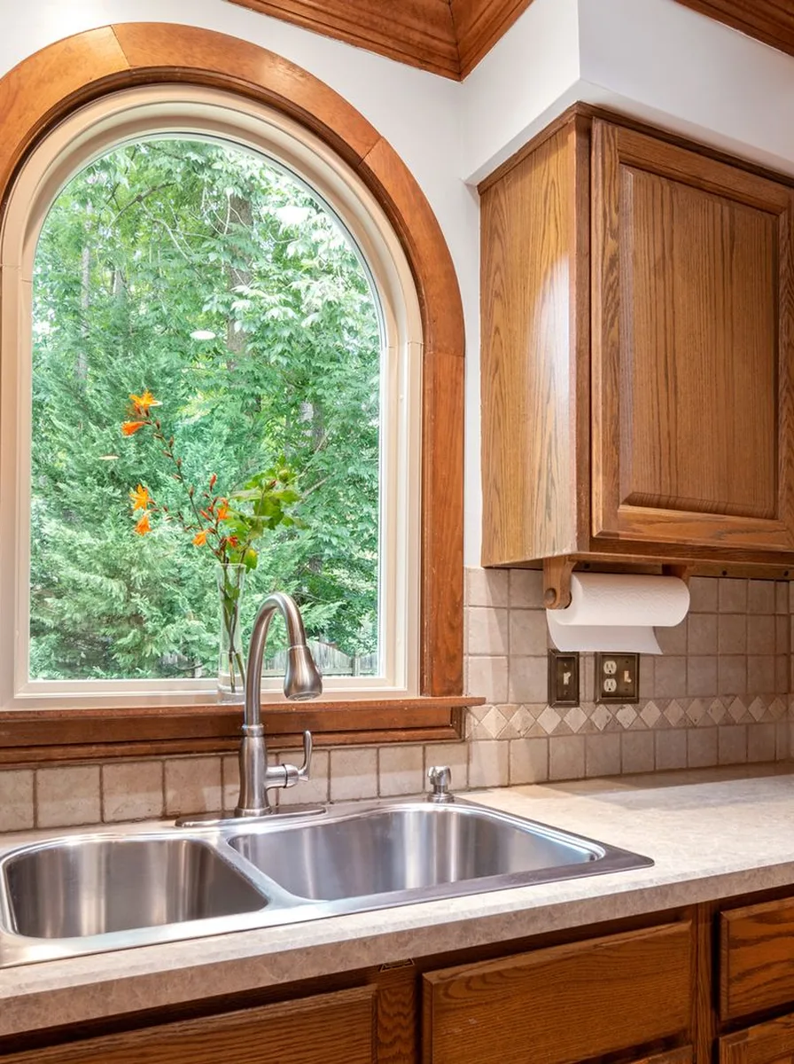 Style with a Single Orchid — kitchen sink under a window
