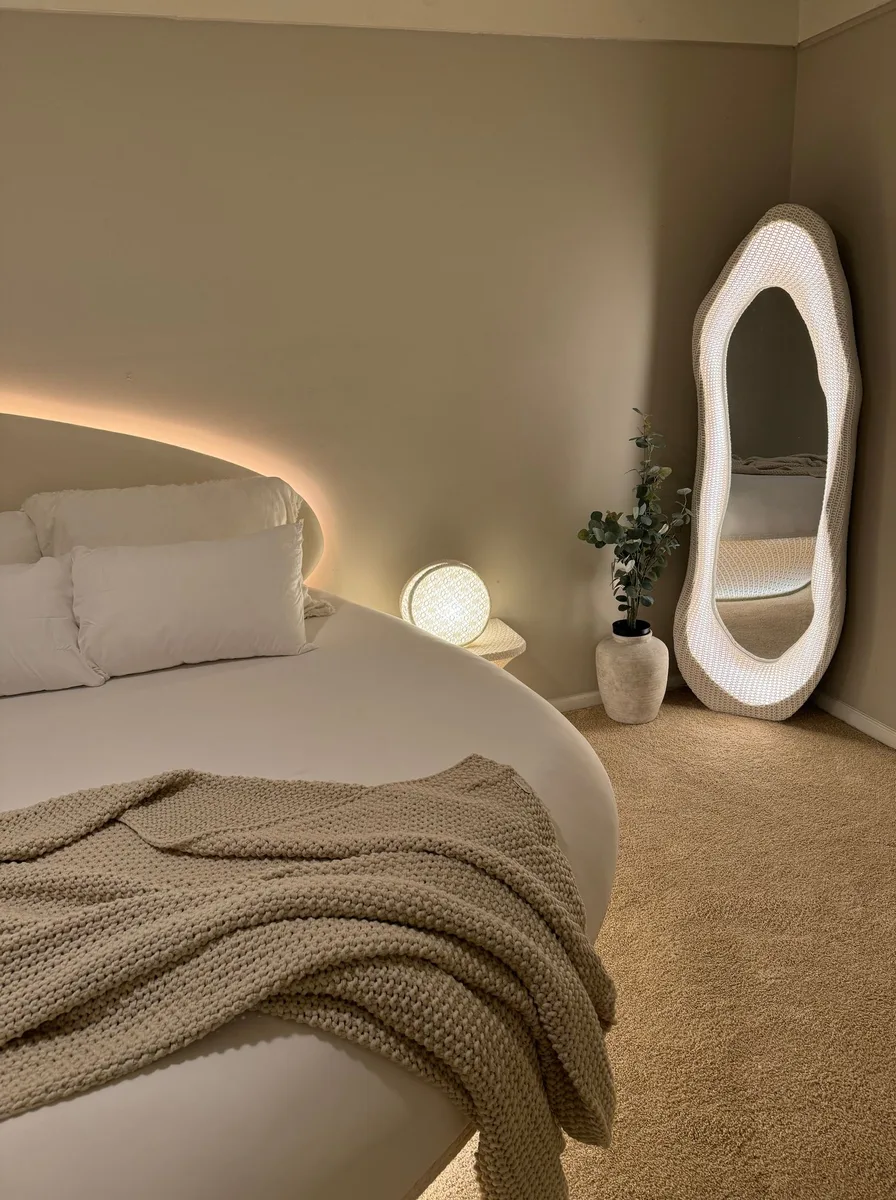 Large mirror brightening a bedroom