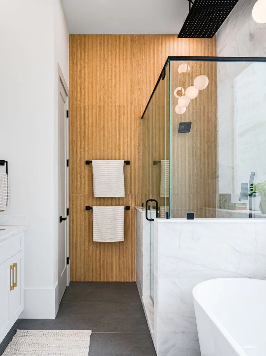 Statement pendant light hanging in elegant bathroom