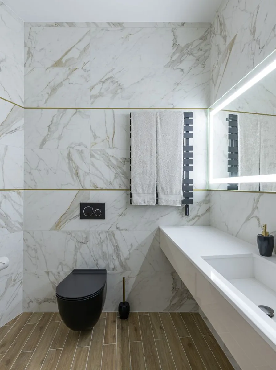Framed art print hanging on bathroom wall