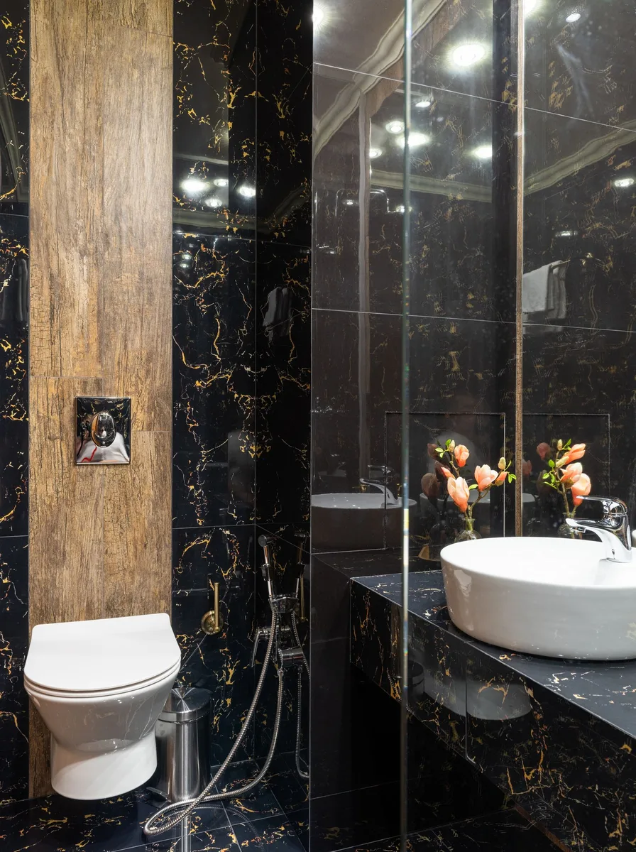 Tiled shower niche holding shampoo bottles neatly