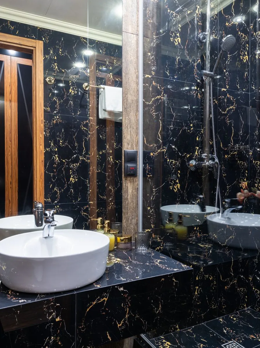 Full length arched mirror leaning in luxury bathroom