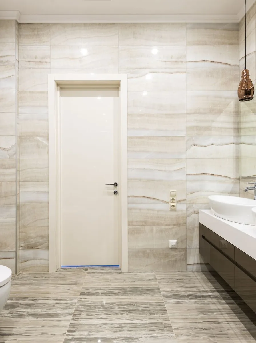 LED strip light glowing under floating bathroom vanity