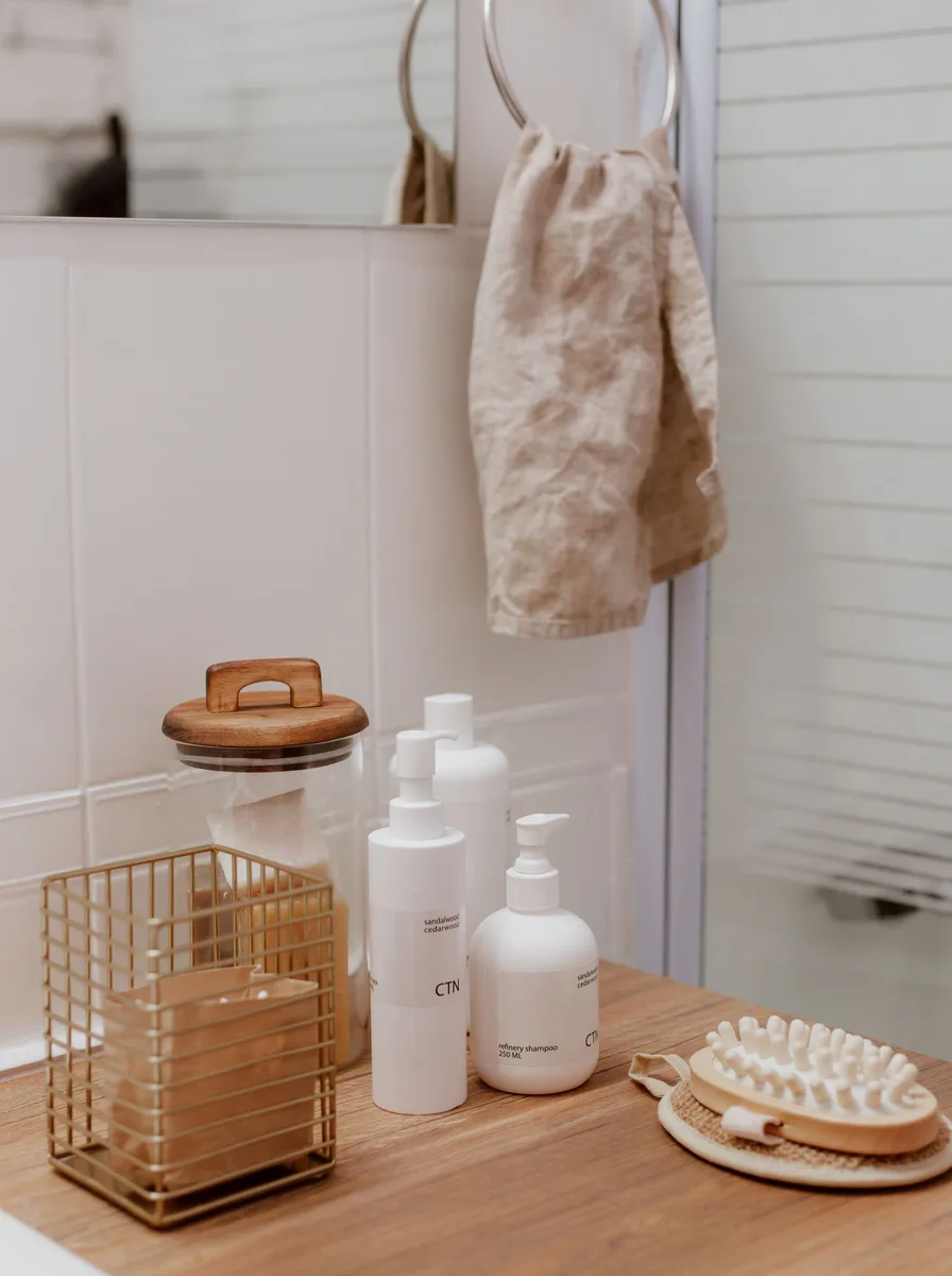 Wall mounted organizer holding hair dryer and styling tools