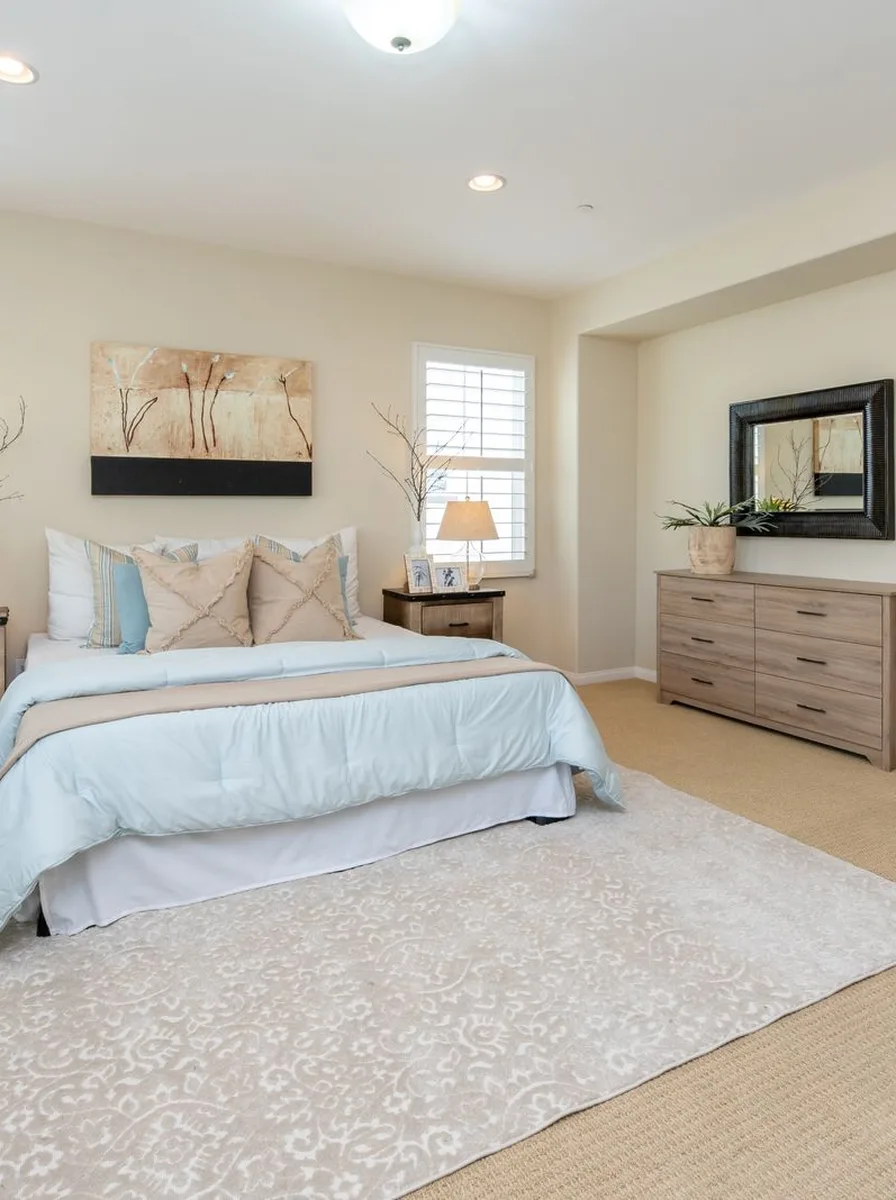 Modern bedroom with yellow walls and stylish decor