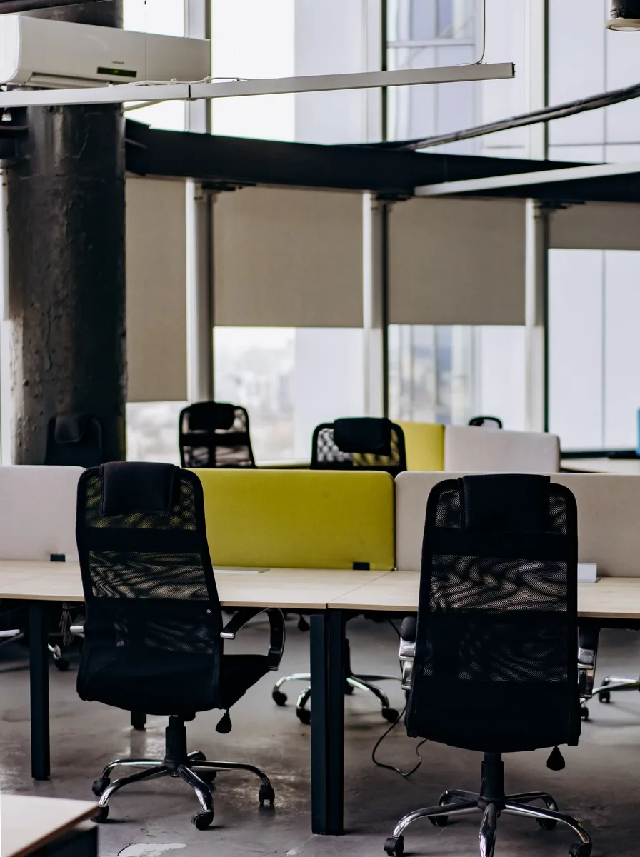 Office chair beside a desk with a laptop