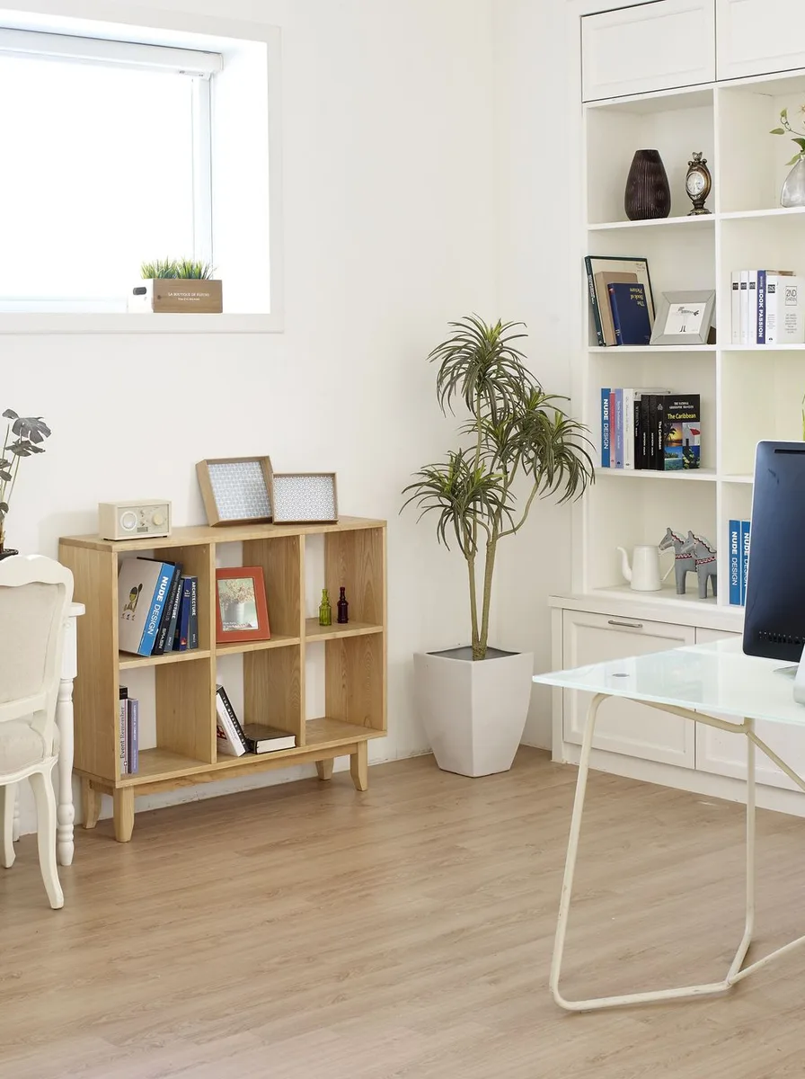 White desk chair at a light wooden desk