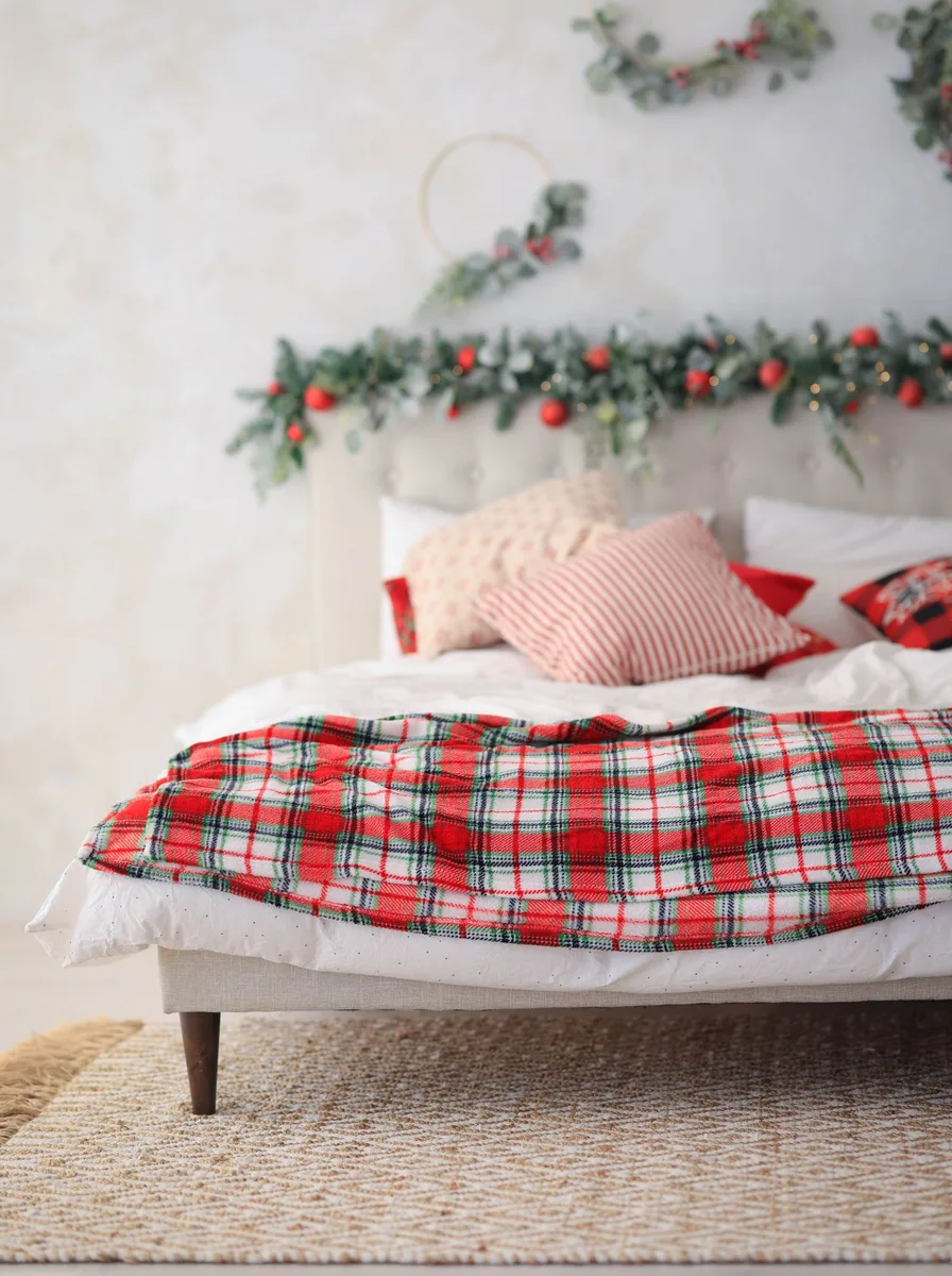 Christmas bedroom with scented candles and cozy holiday atmosphere