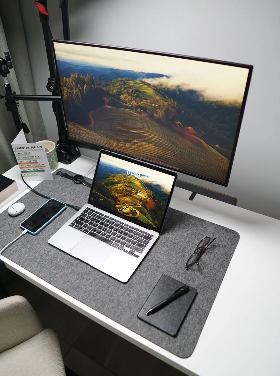 Desk chair tucked under a wooden desk