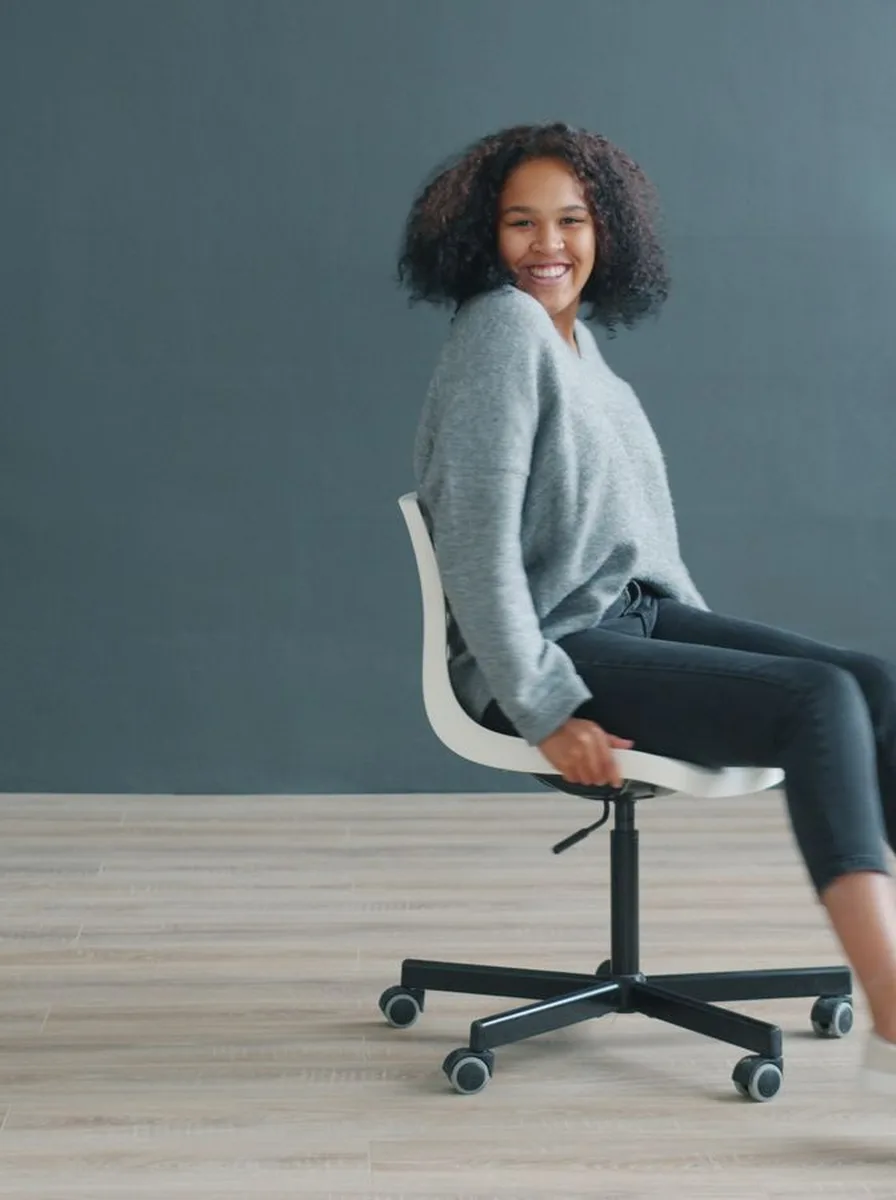 Office chair beside a desk with a laptop