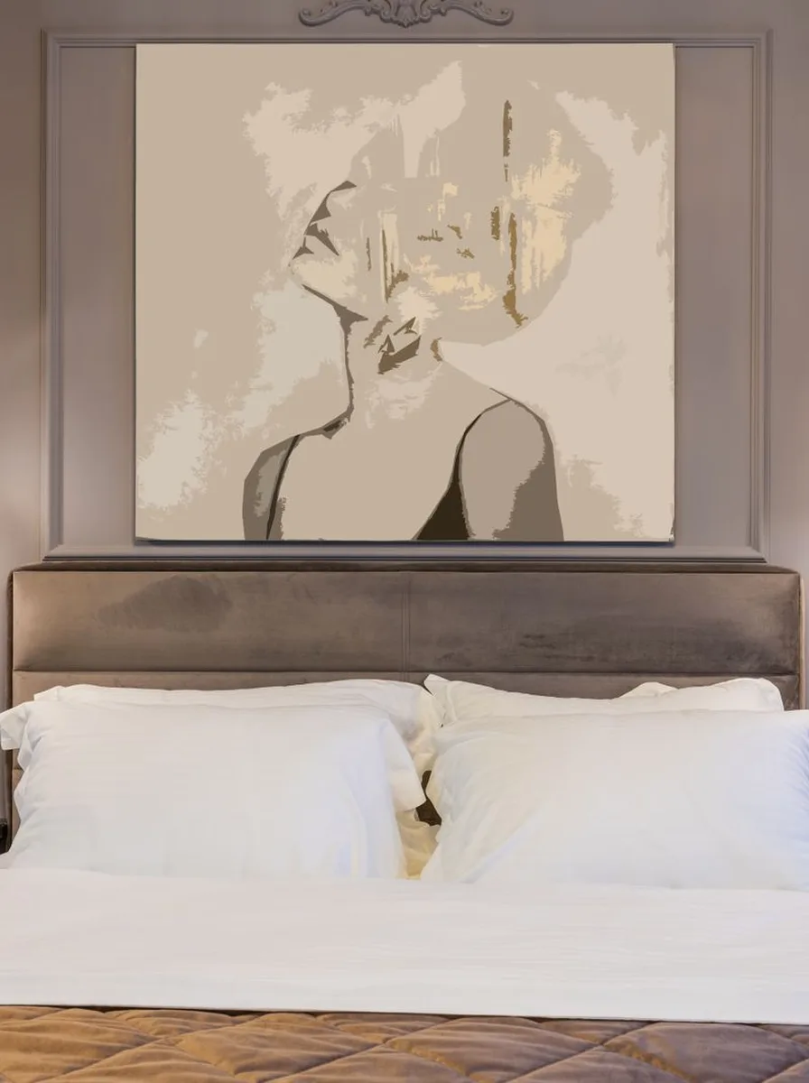 Cozy bedroom with artwork in warm tones