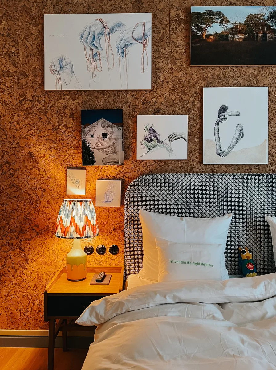 Dark cozy bedroom with gallery wall