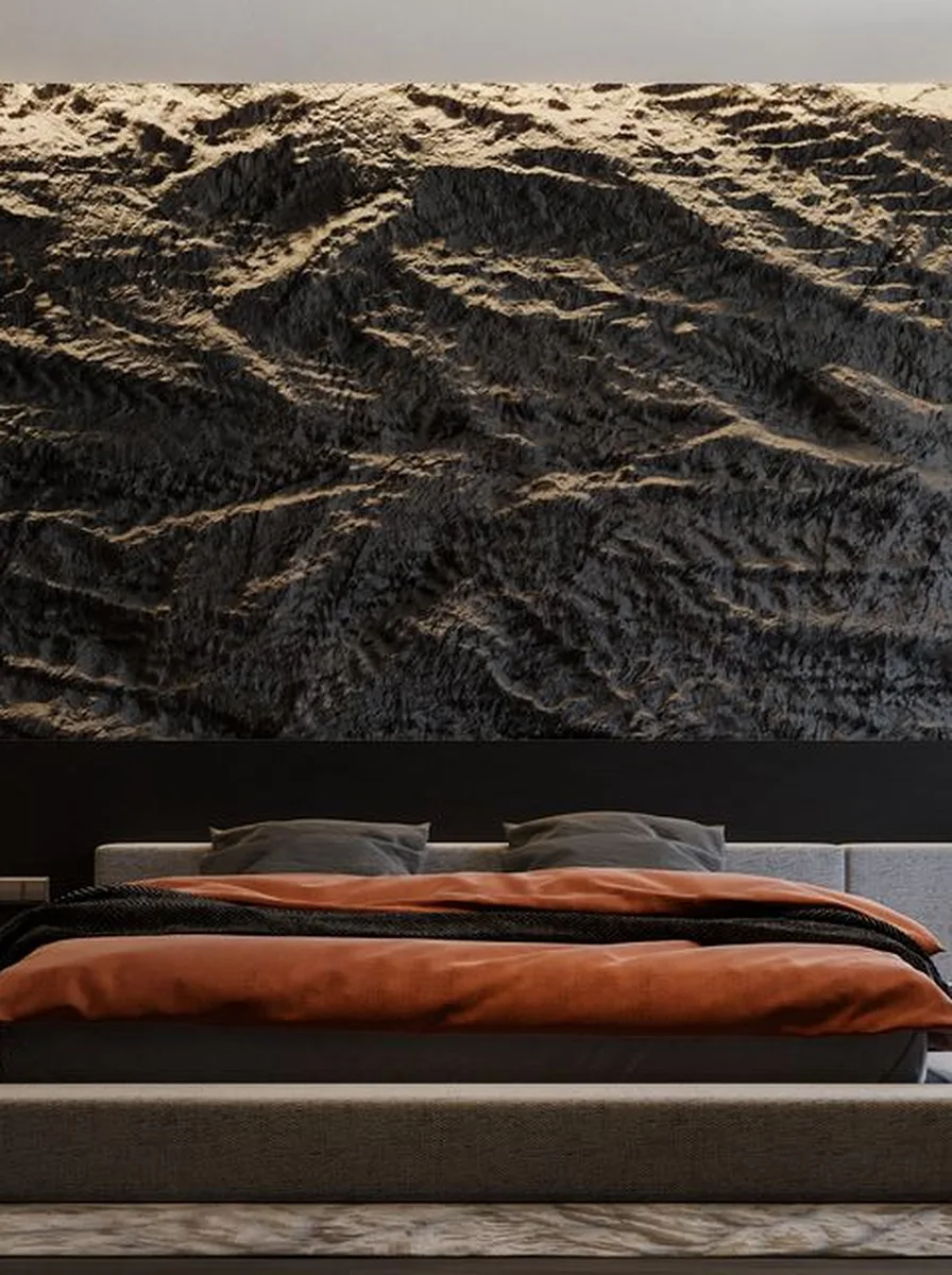 Dark bedroom with stone wall and orange bedding