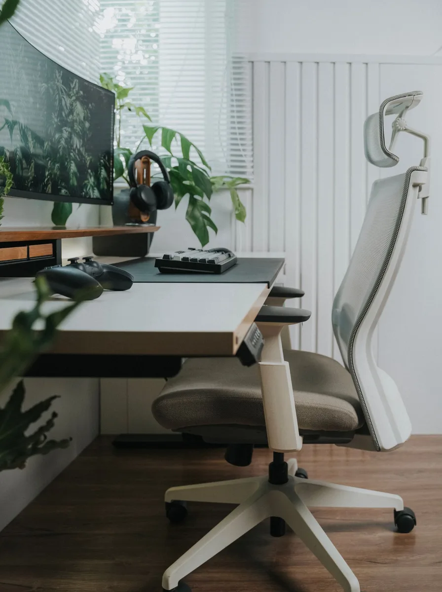 Person stretching their back after sitting in an office chair