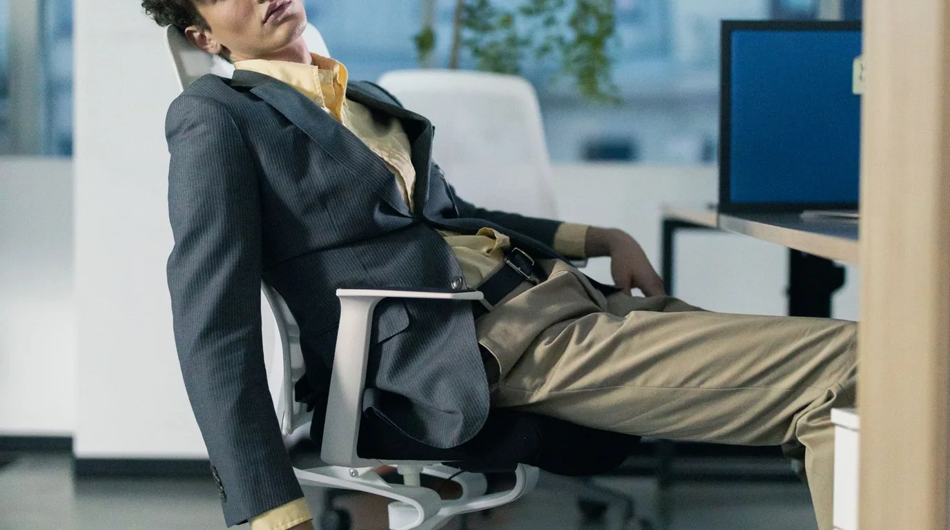 Supportive desk chair with lumbar cushion in a calm home office