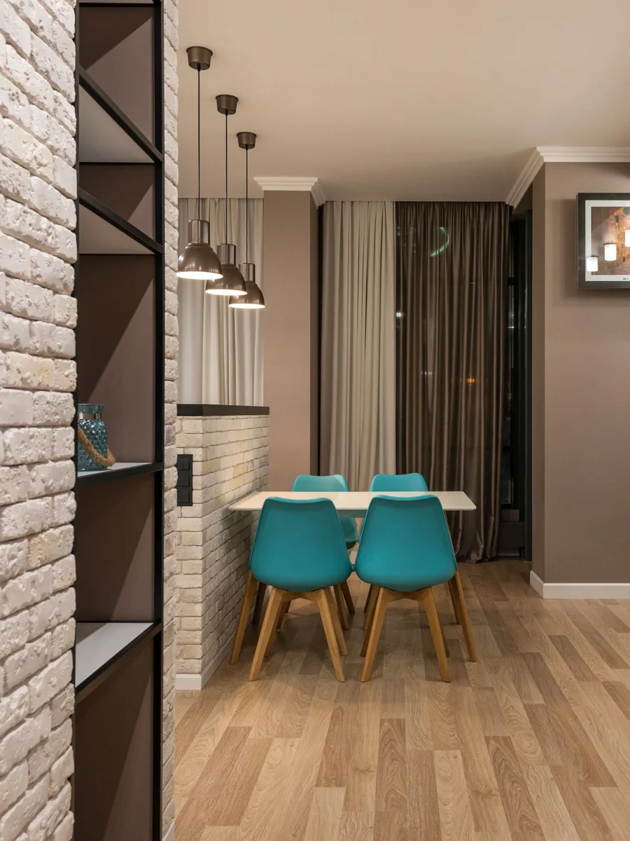 Dining room accent wall with vertical wood slats adding texture