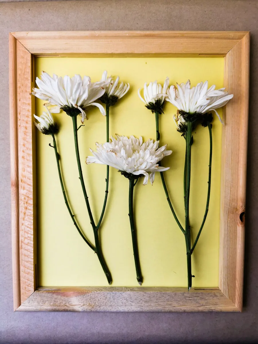 DIY reclaimed wood wall art project in a dining room