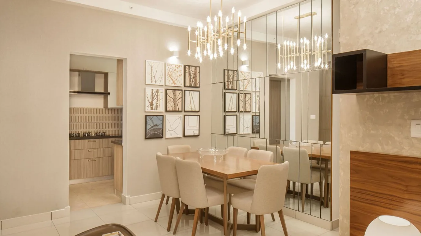 Stunning gallery wall in a dining room with mixed frames and art