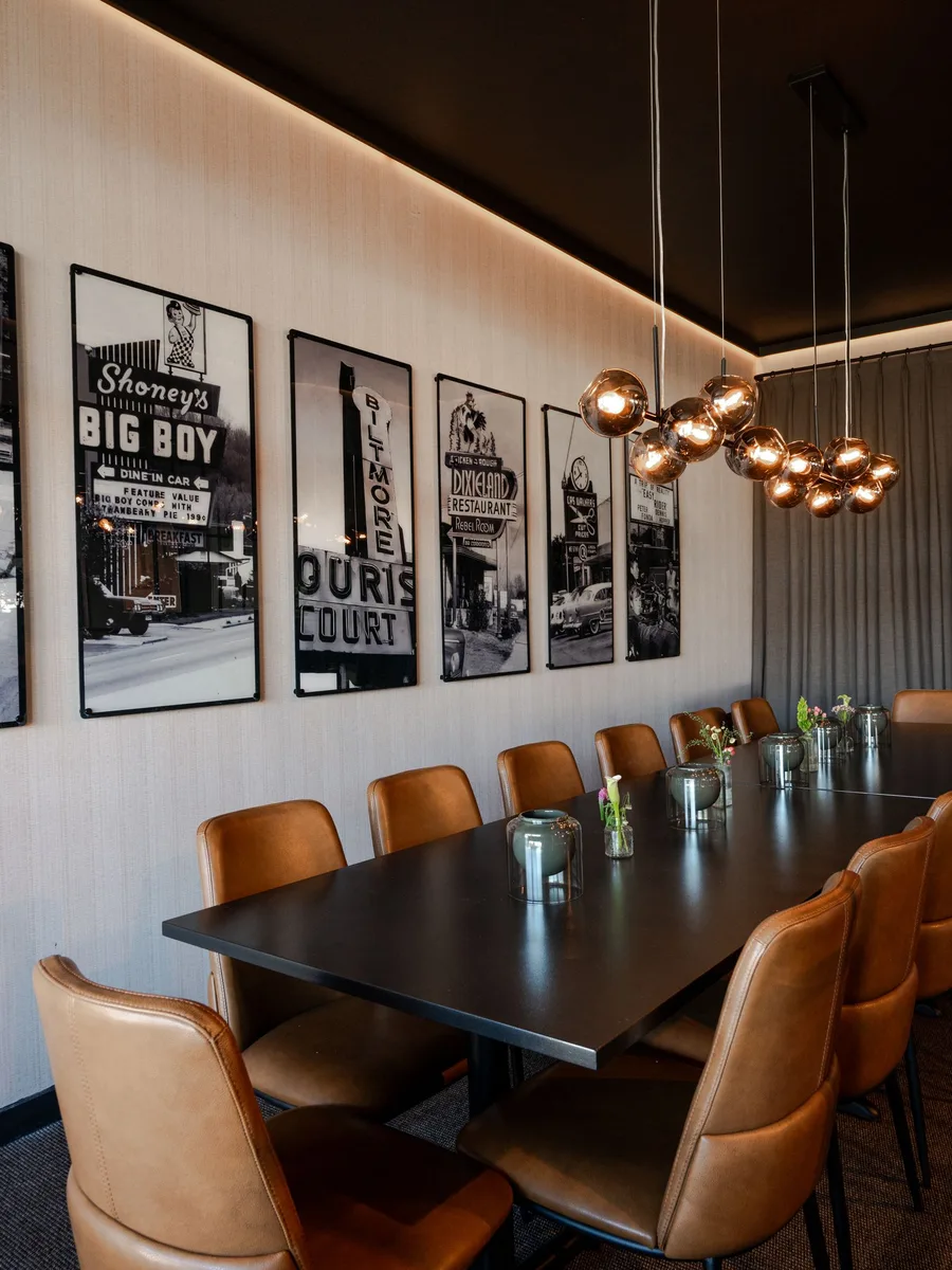Styled modern dining room wall with minimal elegant decor and sideboard