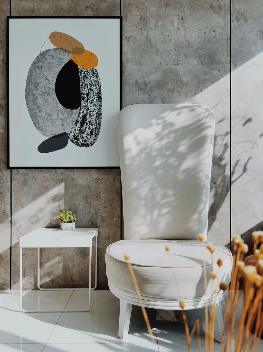 Modern typographic art print with an abstract letter form on a concrete wall