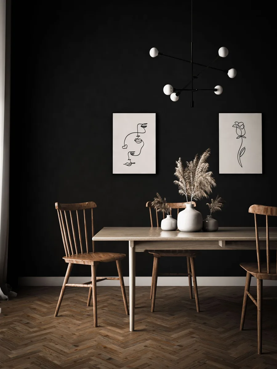 Dining room wall art illuminated by a brass picture light
