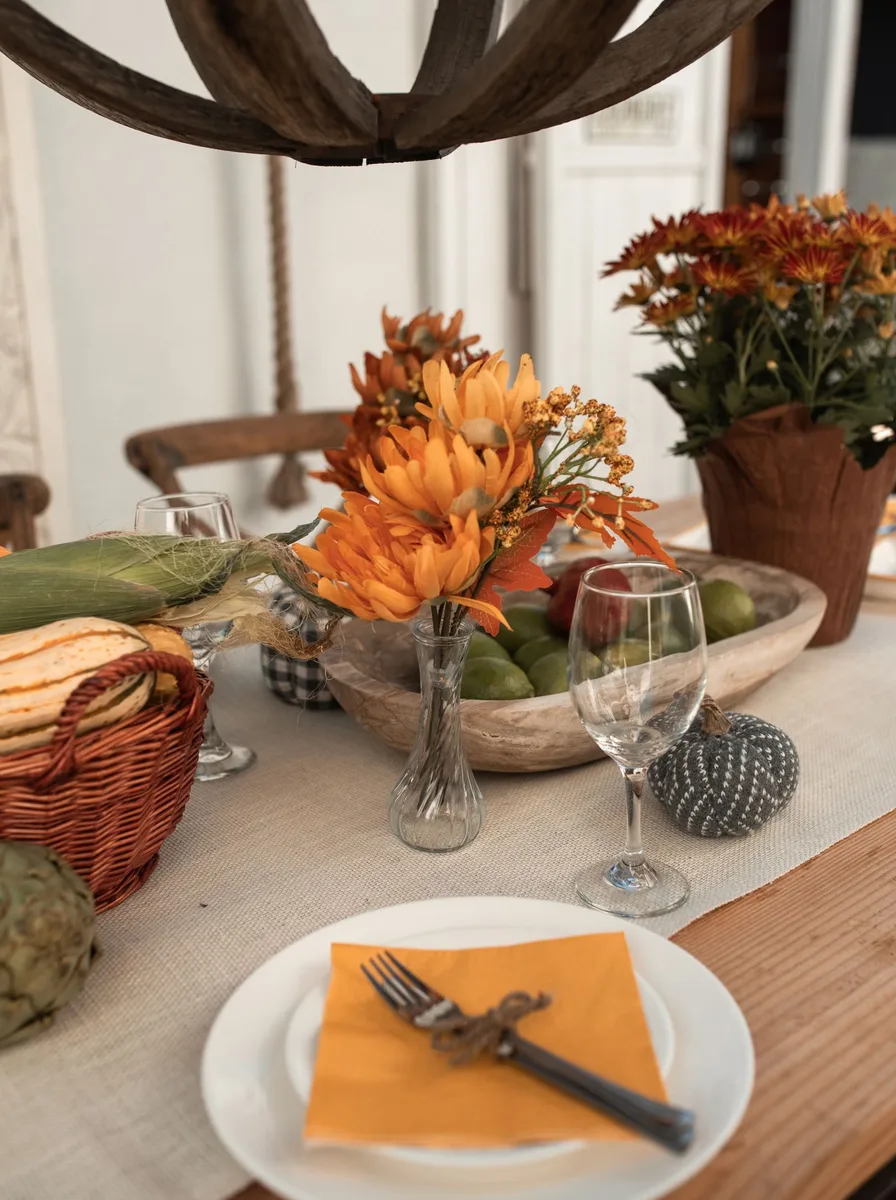 Rustic wooden farmhouse table with burlap runner as dinner table foundation