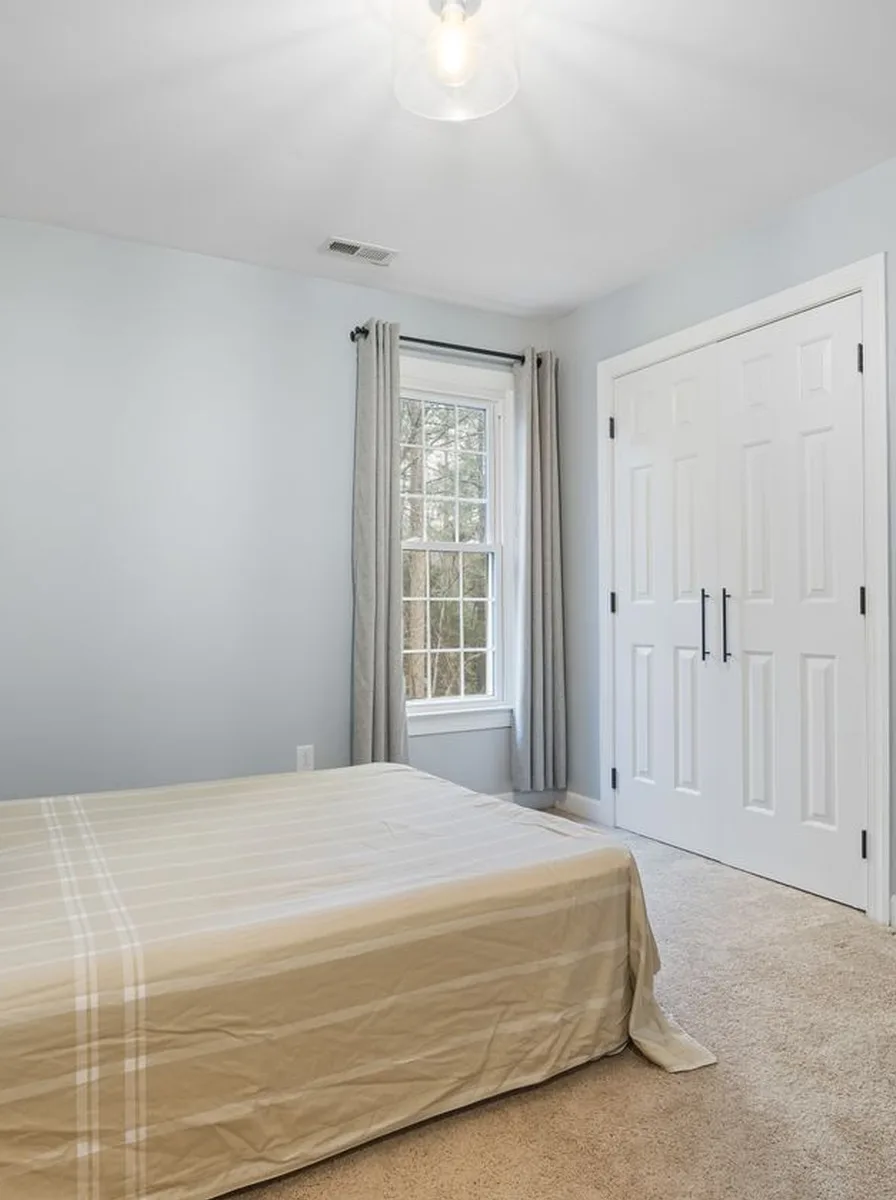 Fabric canopy draped over a teen bed