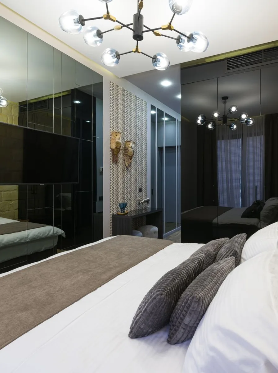 Immaculately clutter-free white bedroom