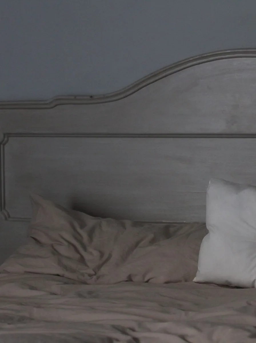 Mirrors multiplying light in a white bedroom