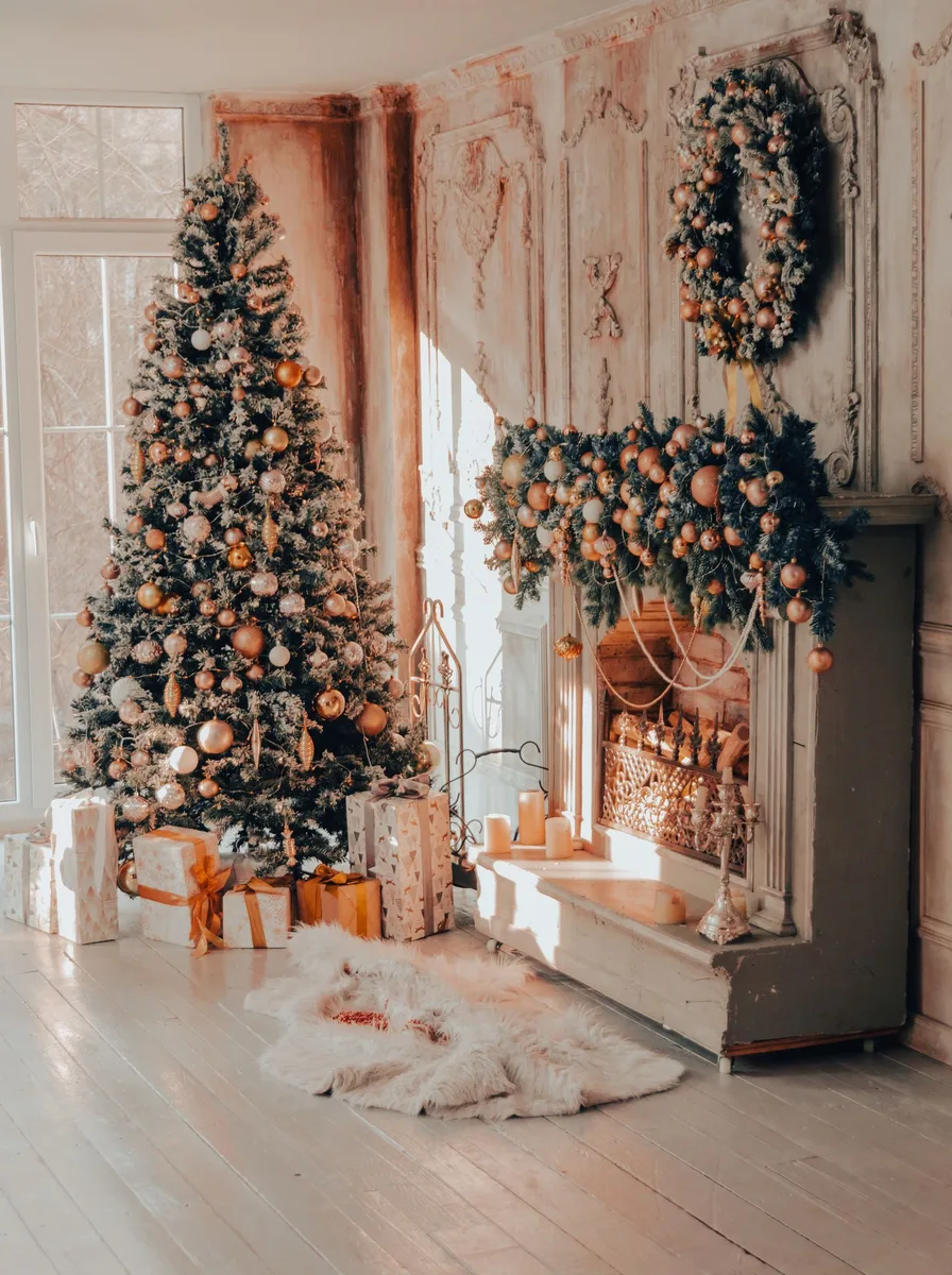 Bed layered with soft white textures and warm glowing Christmas lights