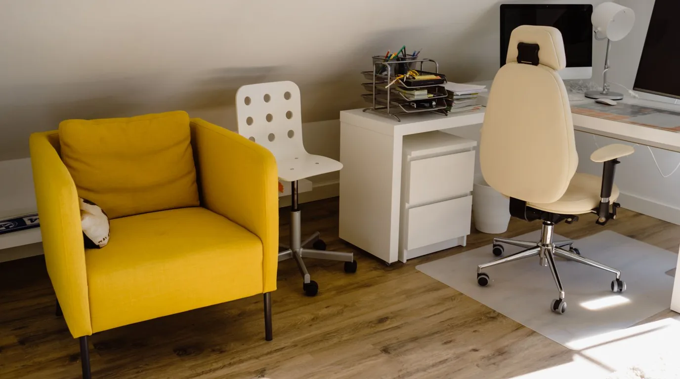 Comfortable home office chair at a desk in a bright living room corner
