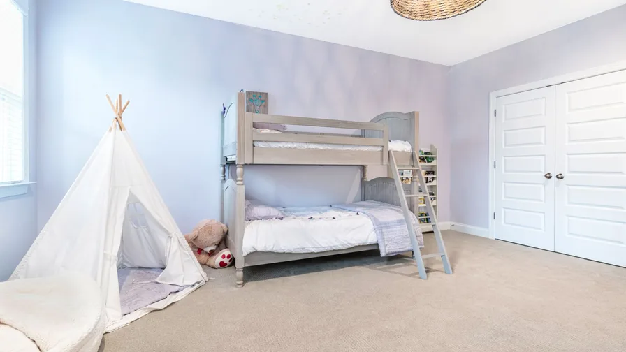 Elegant luxury girls bedroom with blush tones and refined decor