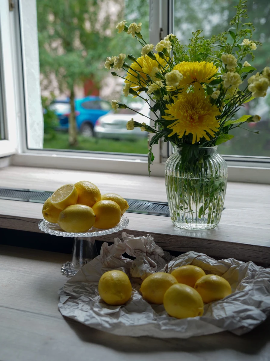 Styled kitchen window with curtains and sill decor