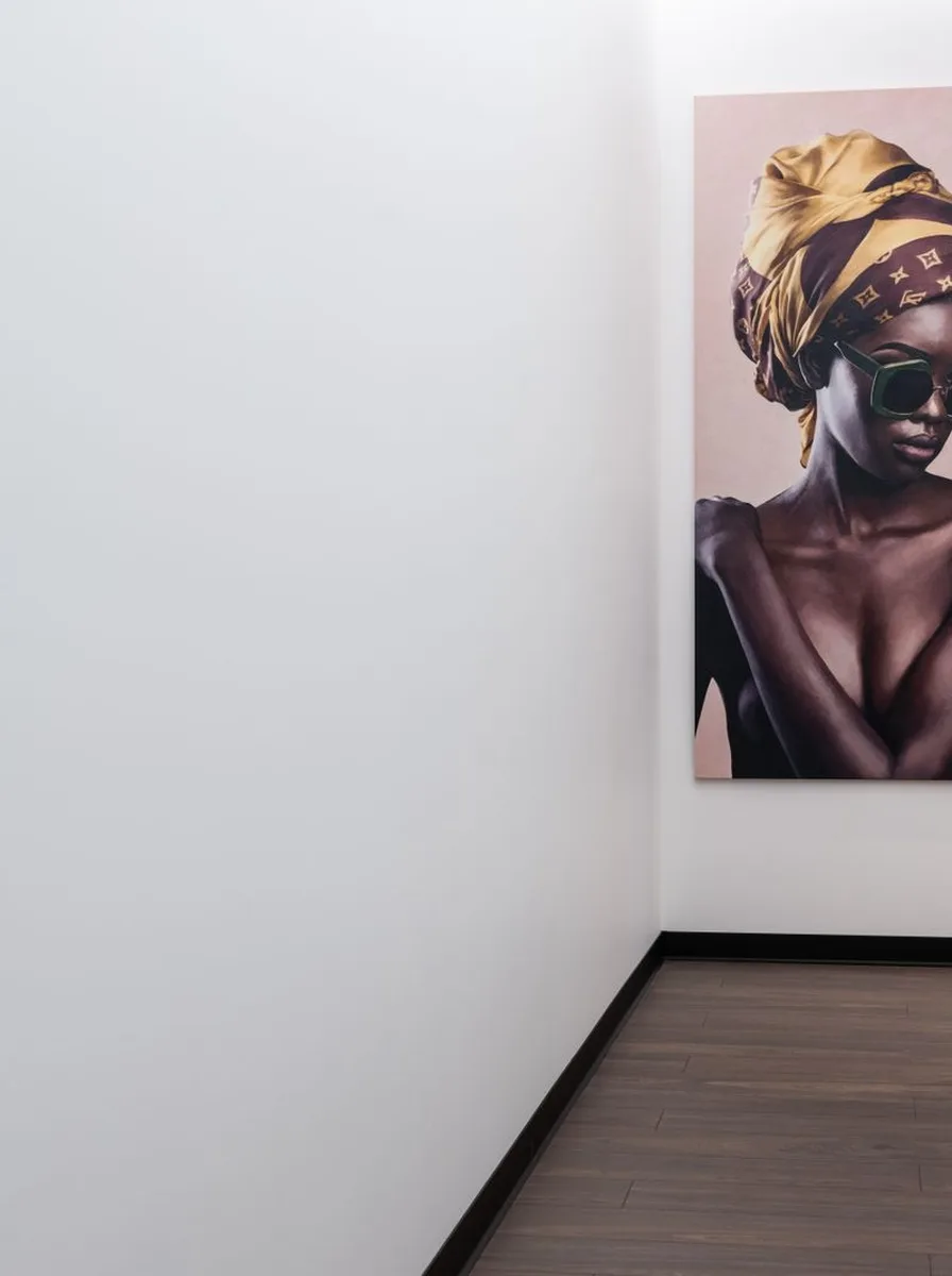 Large portrait of a woman at the end of a hallway