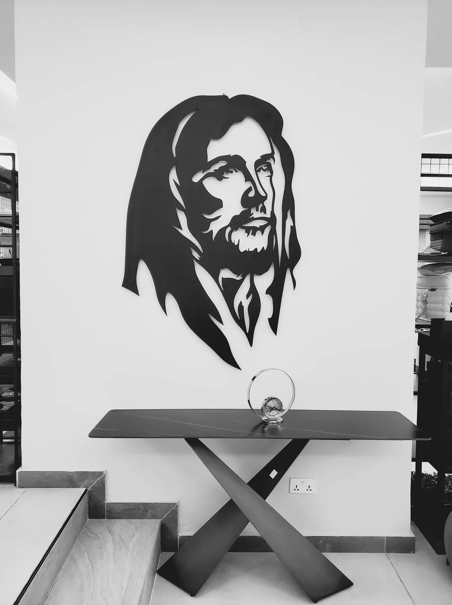 Oversized black-and-white portrait above a console table