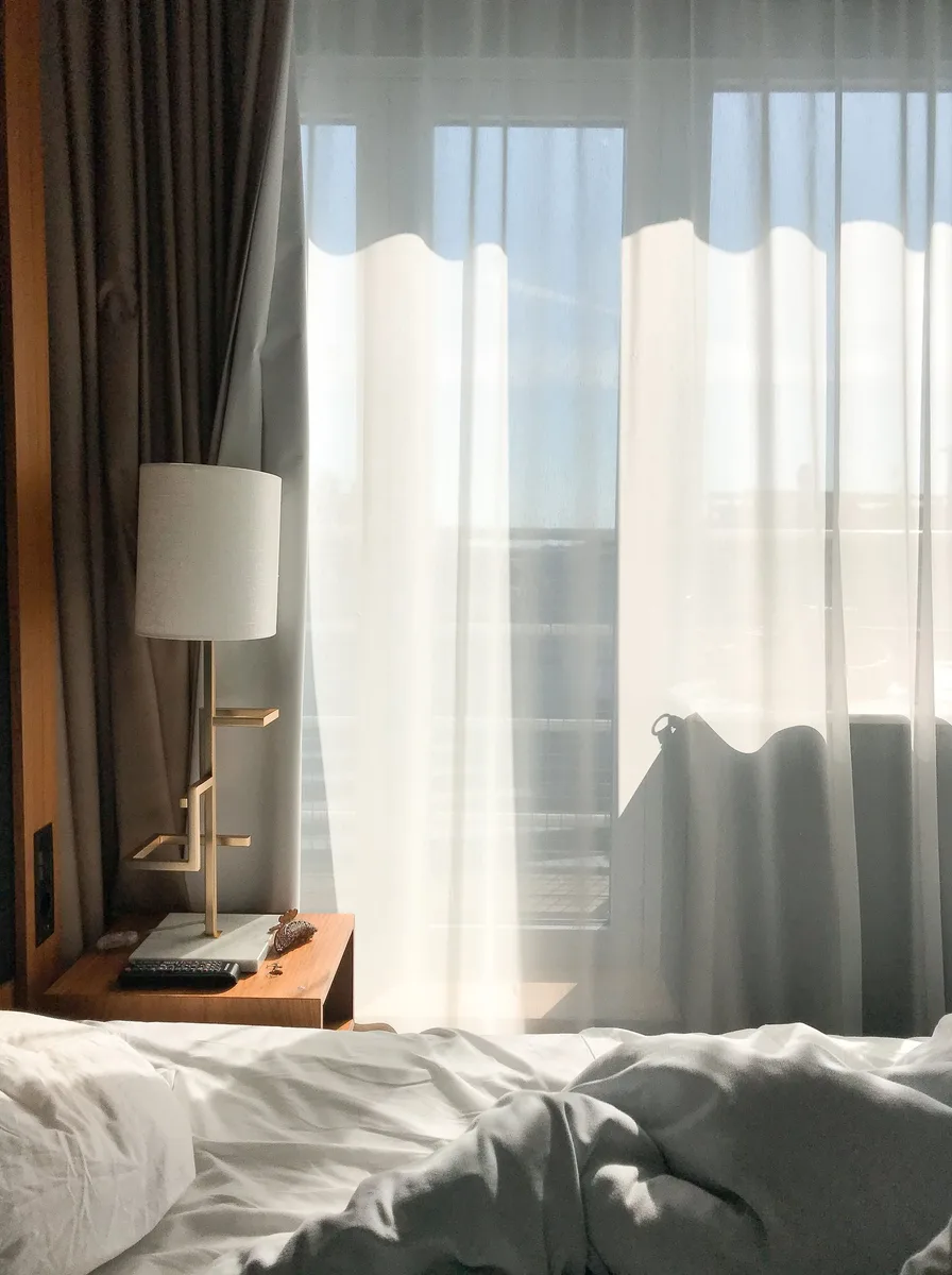 Bright bedroom with sheer curtains