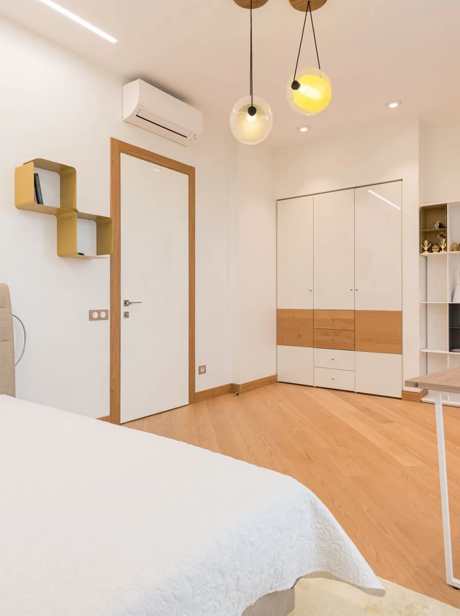 Bright bedroom with yellow pendant lights