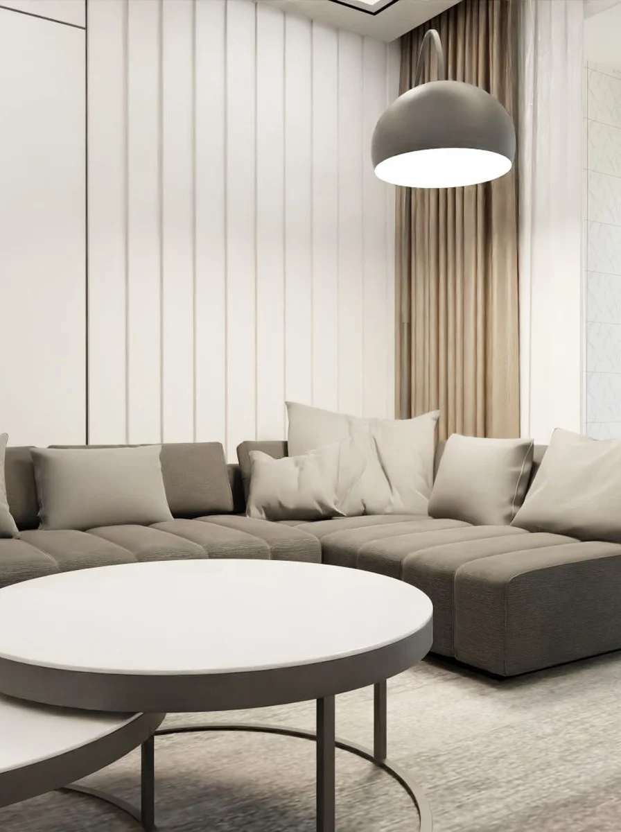 Warmly lit luxury living room with layered lamps and candles glowing at dusk