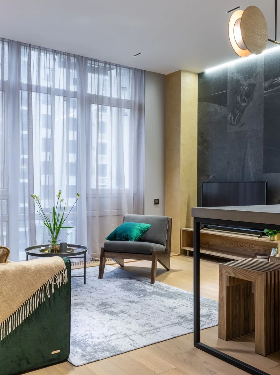 Minimalist living room with hidden storage console and tidy closed cabinets