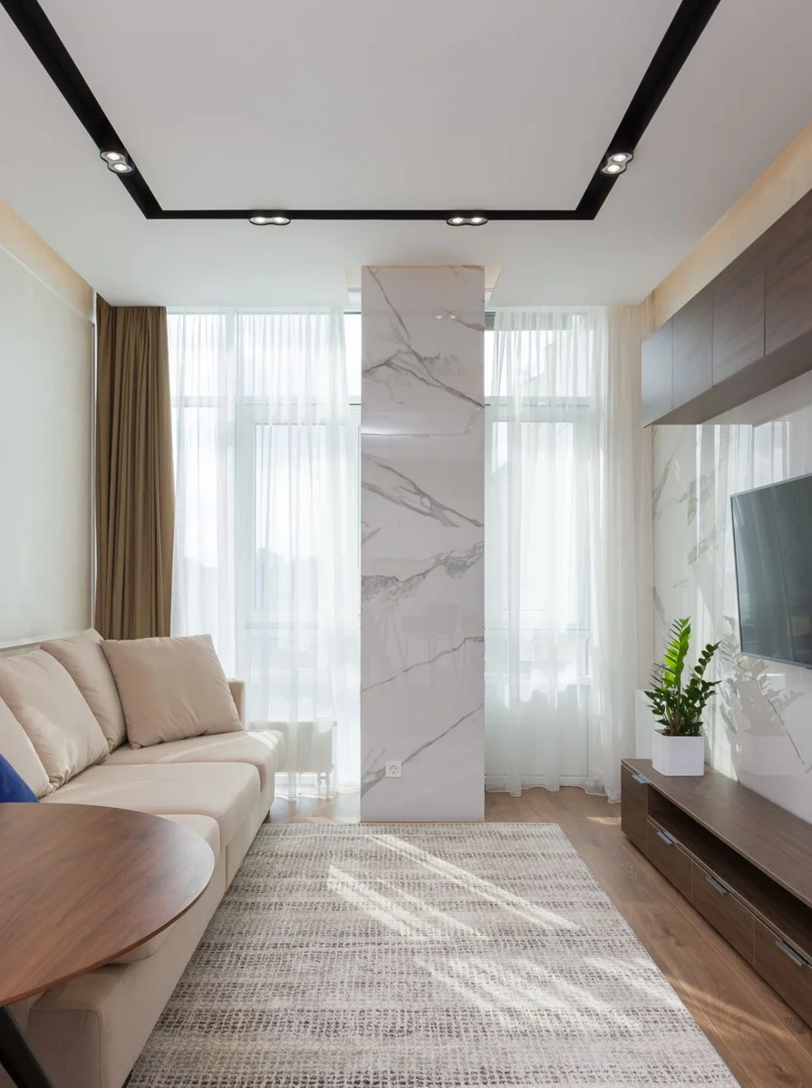 Living room in soft beige and sage tones with natural wood textures