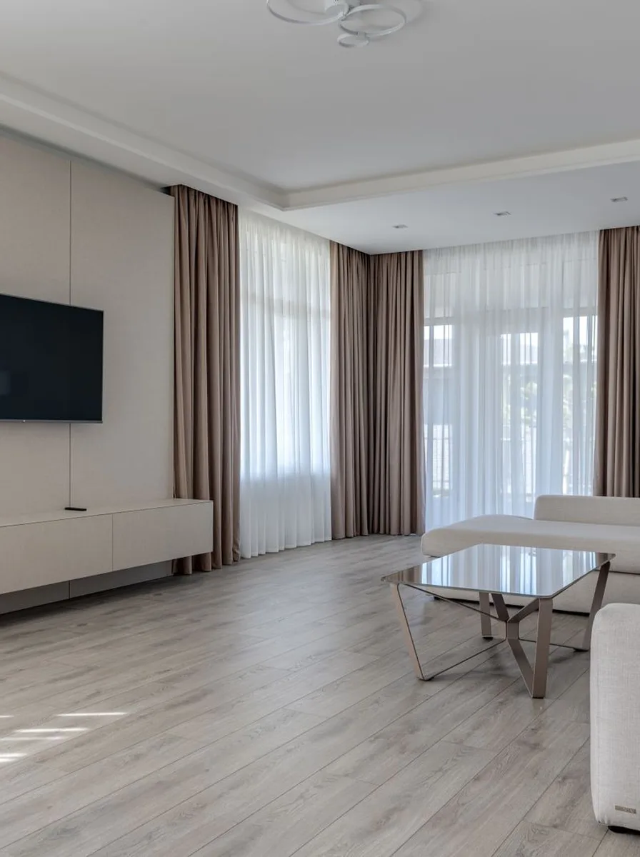 Black and white living room softened with a warm wood coffee table