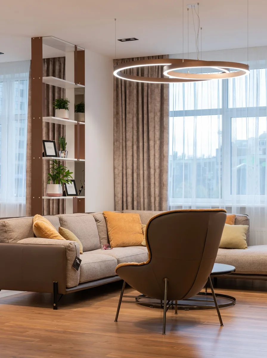 Modern monochrome living room mixing glossy and matte black finishes