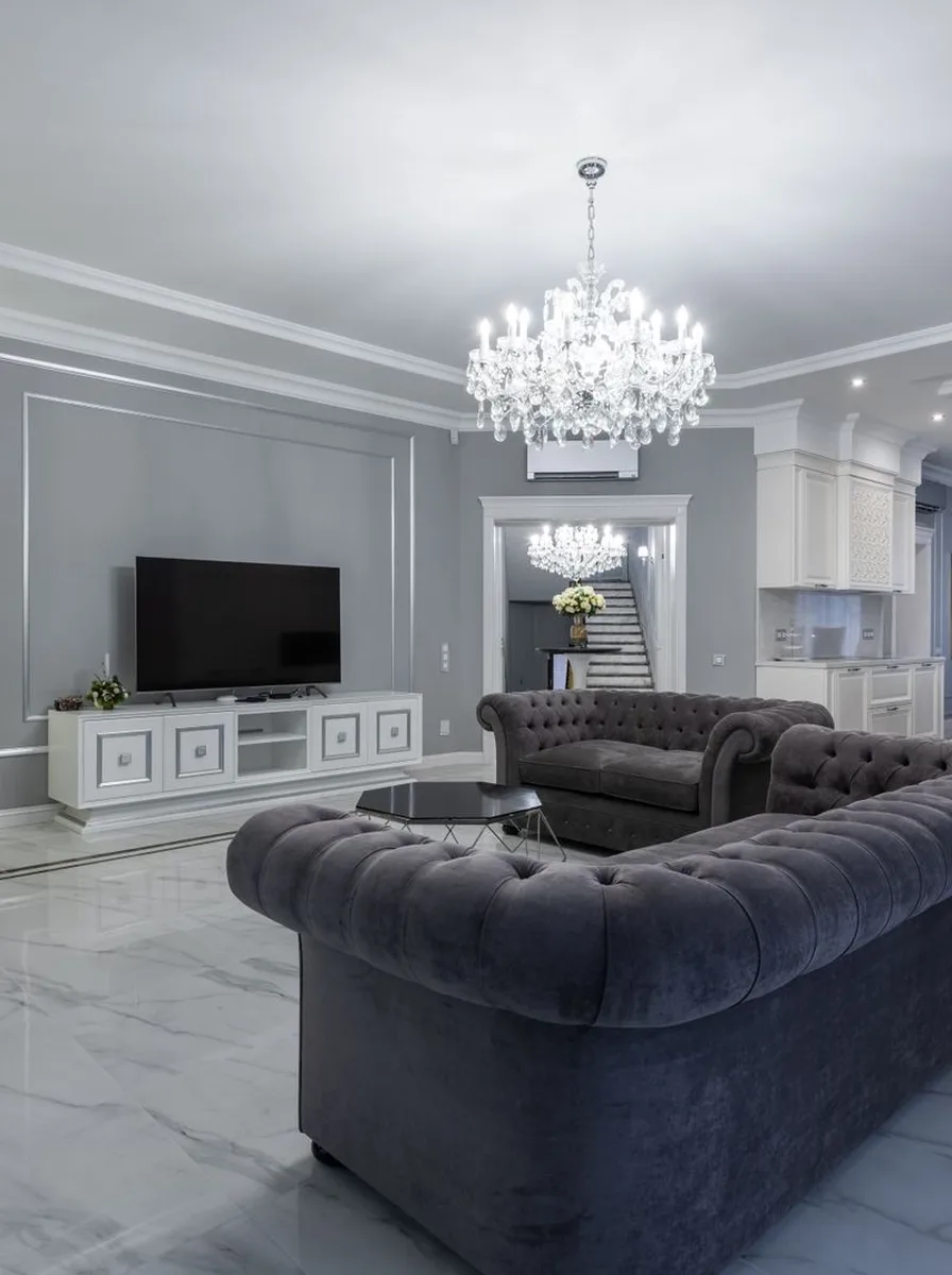 Contemporary living room with pendant lights over the seating area