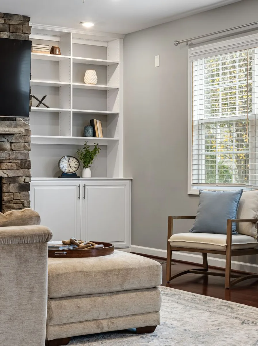 Elegant fireplace mantel styled with symmetrical decor and a large mirror
