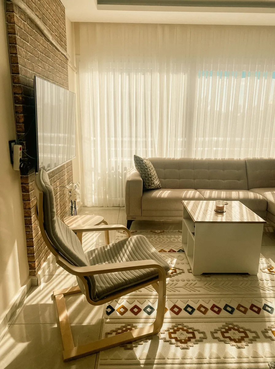 Luxury living room with a richly patterned rug anchoring the conversation area