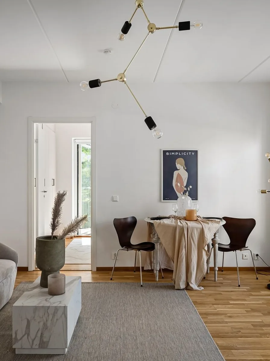 Luxury living room with light wood floors balancing elegant furnishings