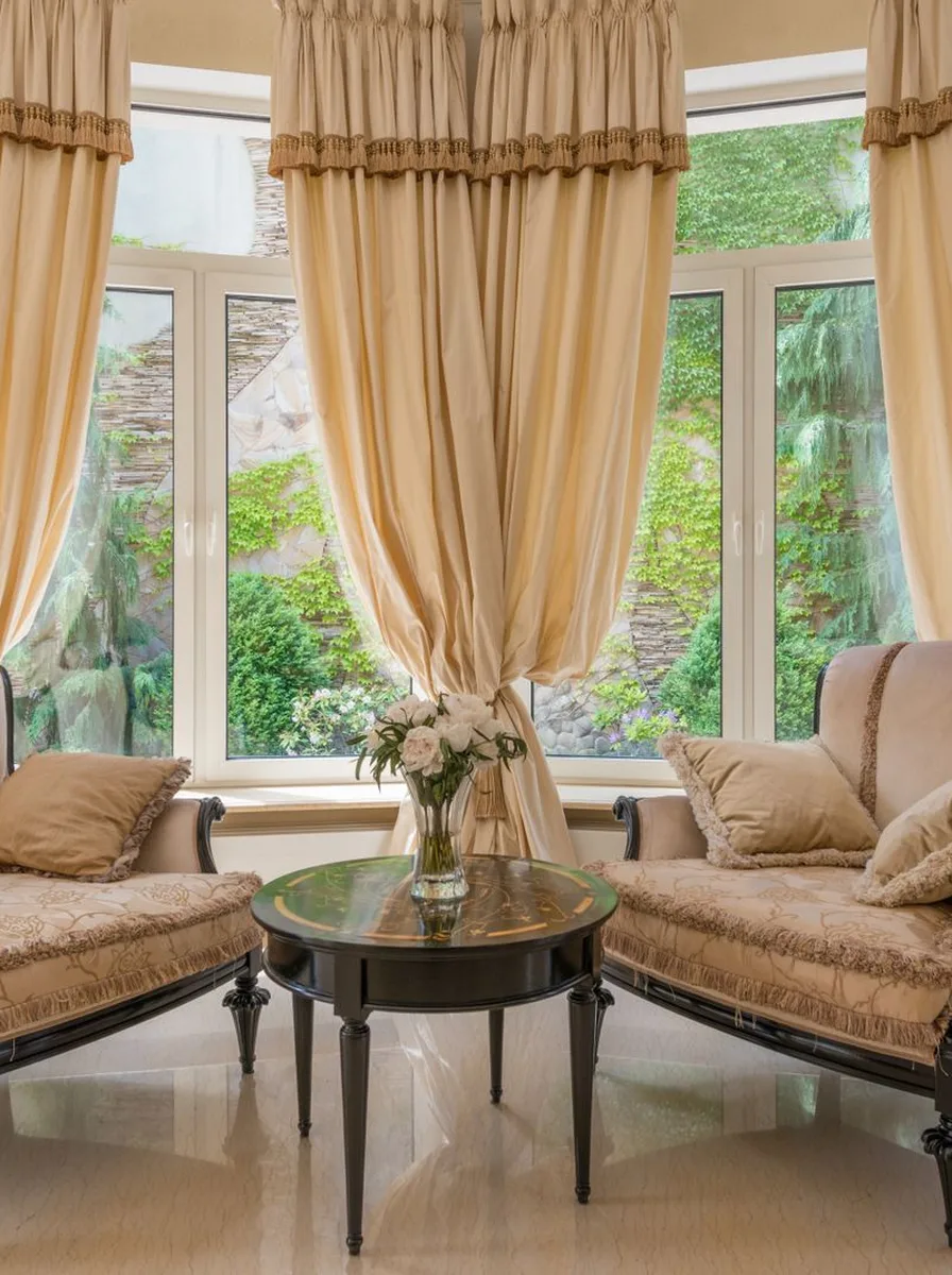Minimalist living room with sheer curtains softening the light