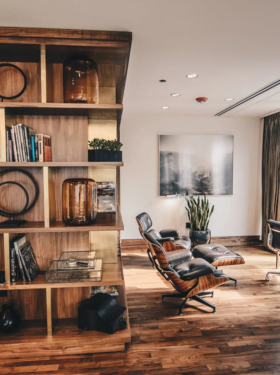 Brown leather desk chair at a wooden desk