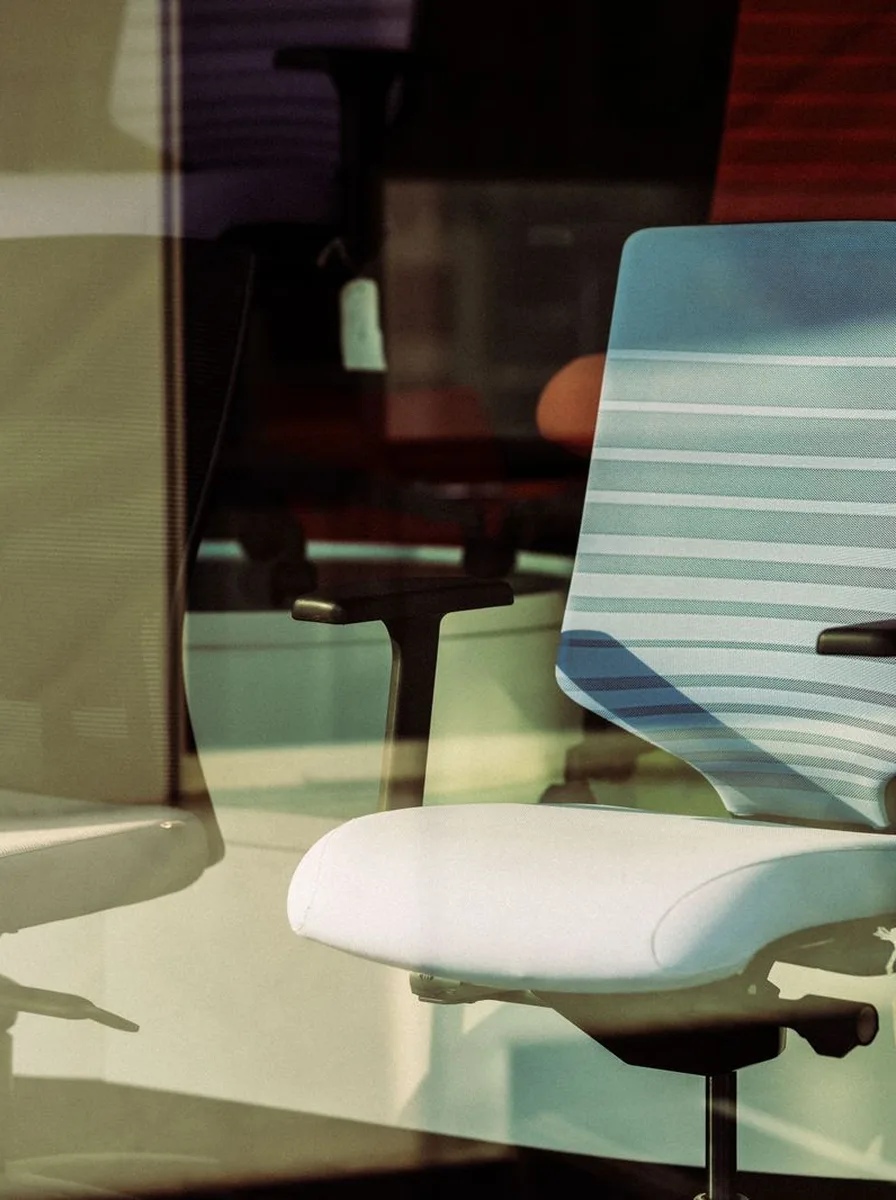 Modern mesh task chair at a standing desk