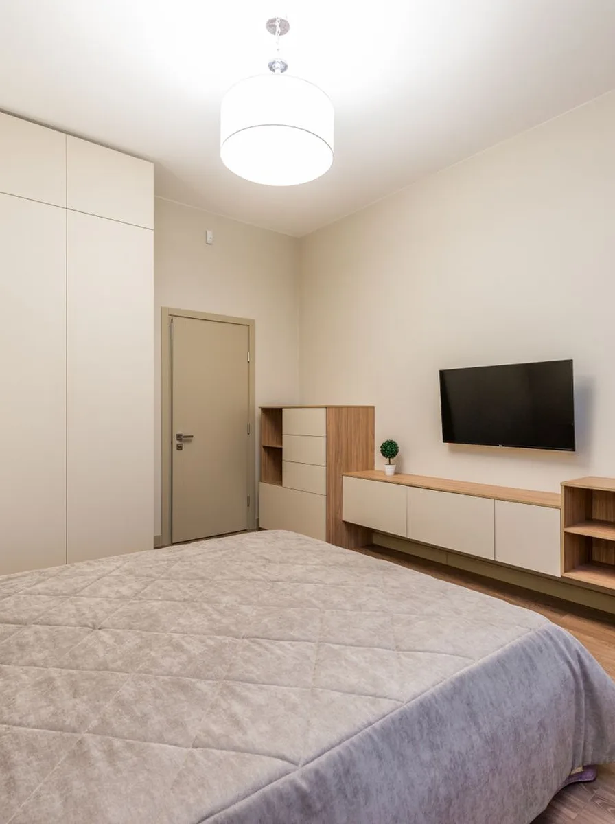 Clean minimalist bedroom in soft grey tones